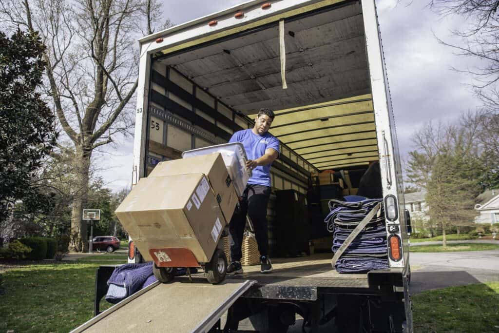 A person loading a truck with boxes